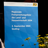 Plakat mit Logo der Regierung von Oberbayern und Text: Regionale Freisprechungsfeier der Land- und Hauswirtschaft 2024, 3. September 2024, Grafing